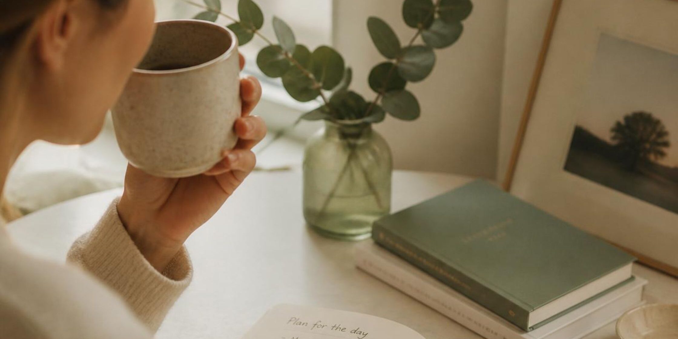 planning_your_day_featured Learn from this woman in planning your day in a notebook with a cup of coffee.