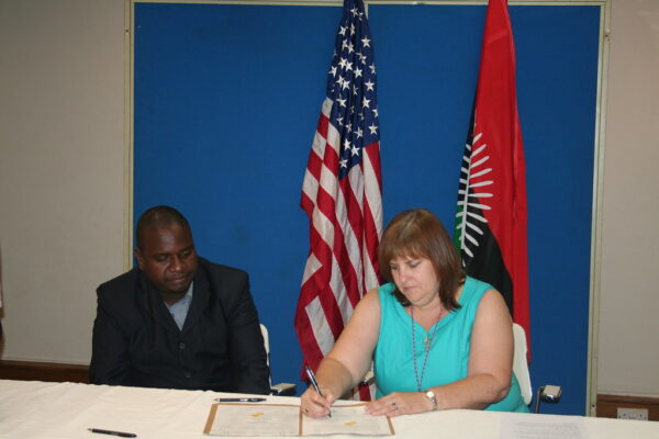 George Kayange during the grant signing ceremony for the school library construction project